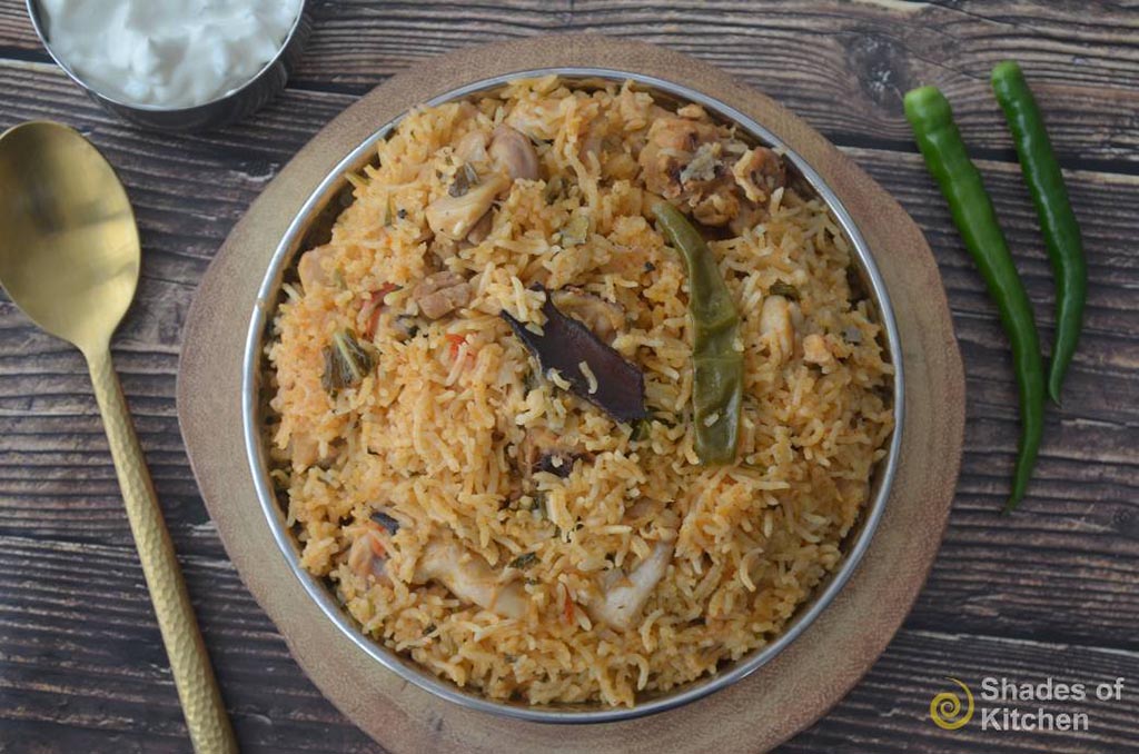 Pressure cooker chicken sales biryani home cooking
